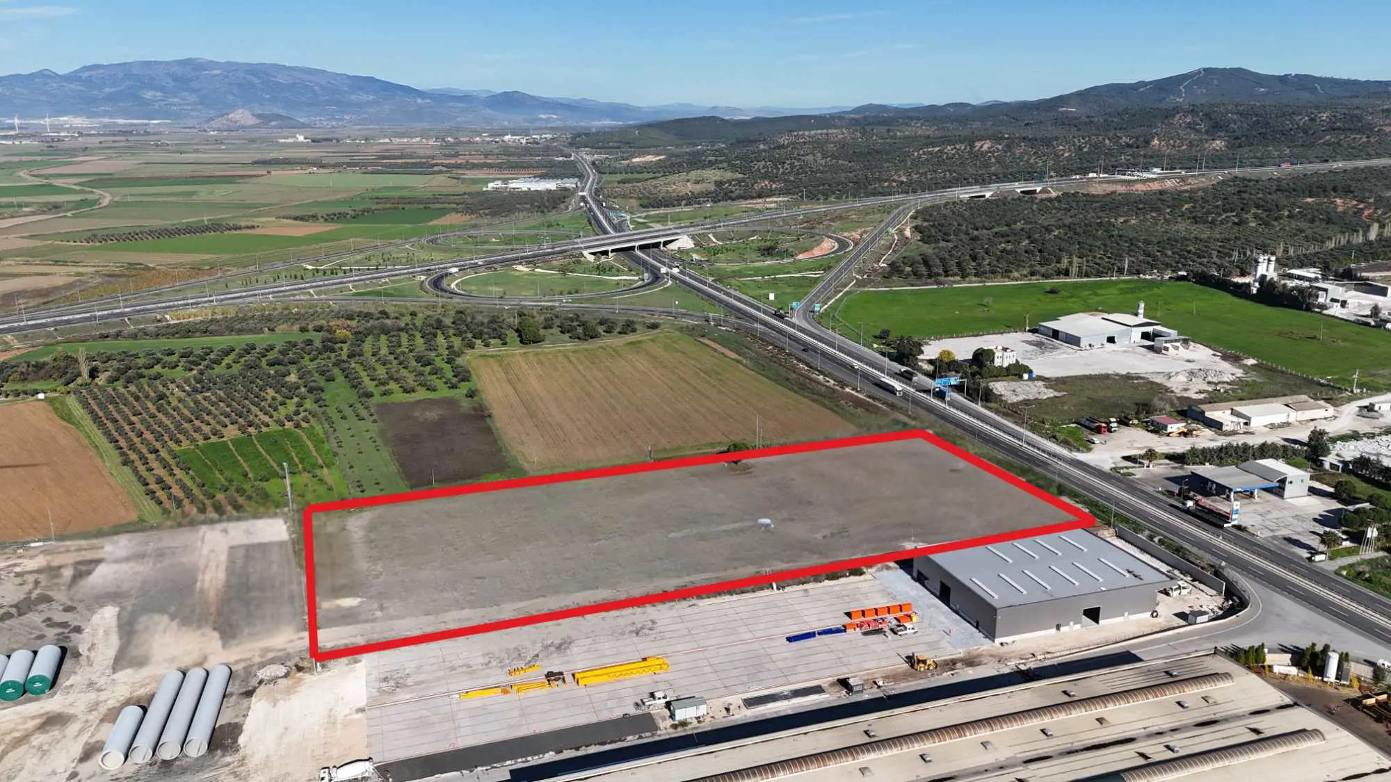 İZMIR-ÇANAKKALE YOLUNA CEPHELI 23.926 M² TICARI DEPOLAMA ARSASI